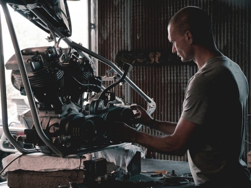 man buying used auto parts - engine